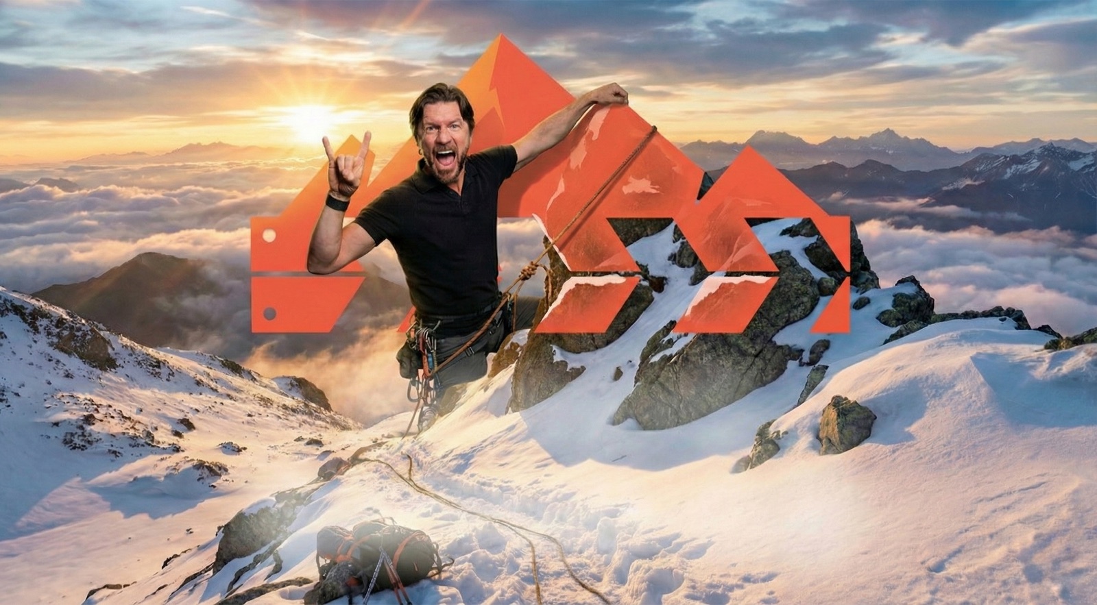 Ryan Koral celebrating on a mountain summit at sunrise